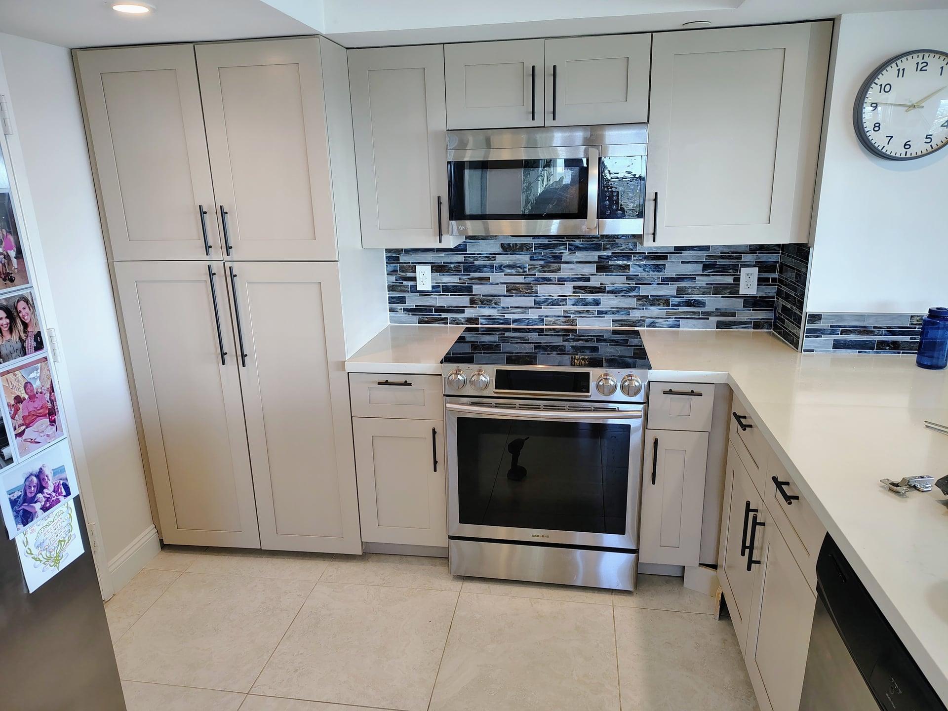 Professionally refinished white kitchen cabinets