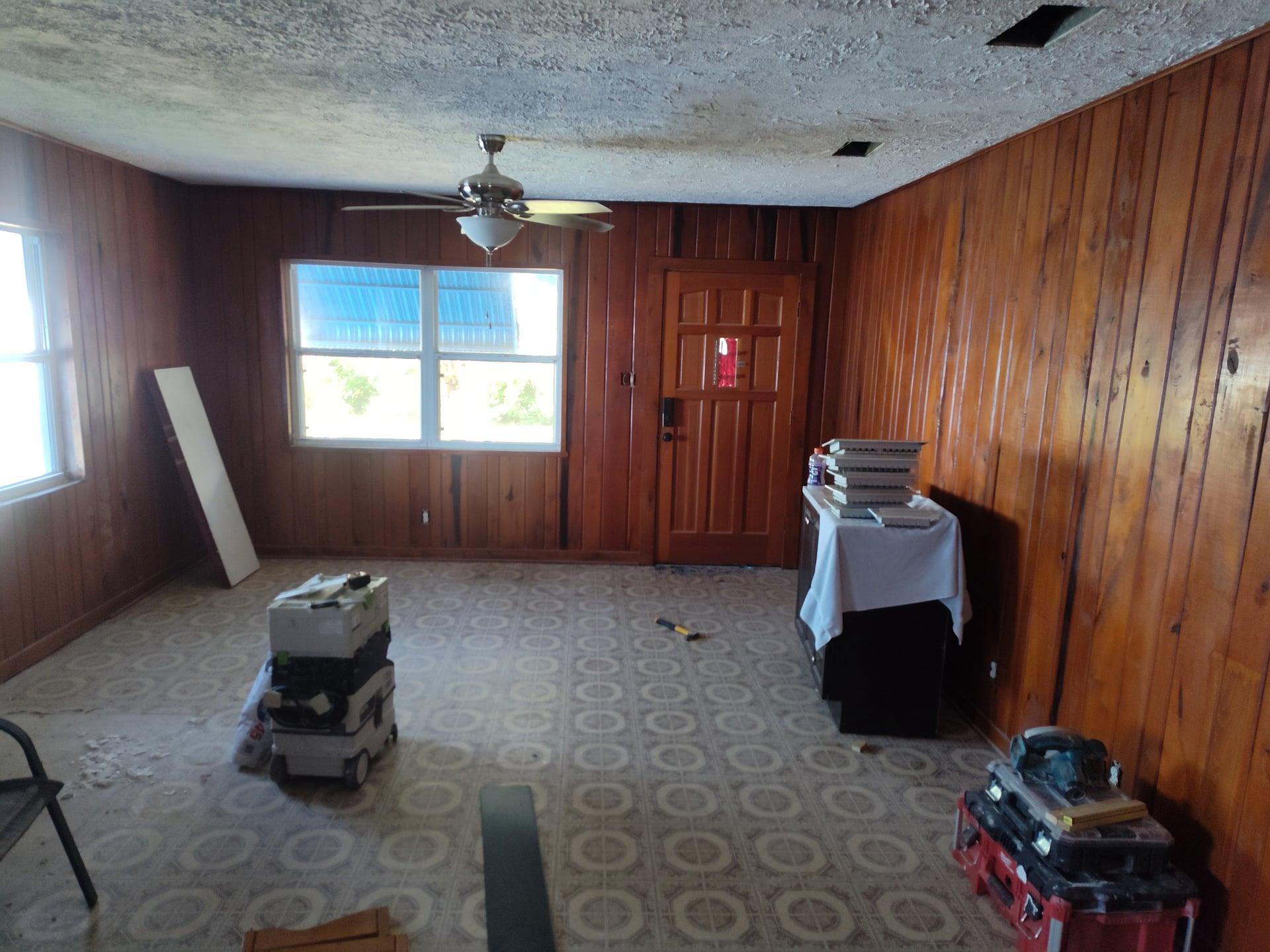 Interior room prepared for drywall repair and ceiling work